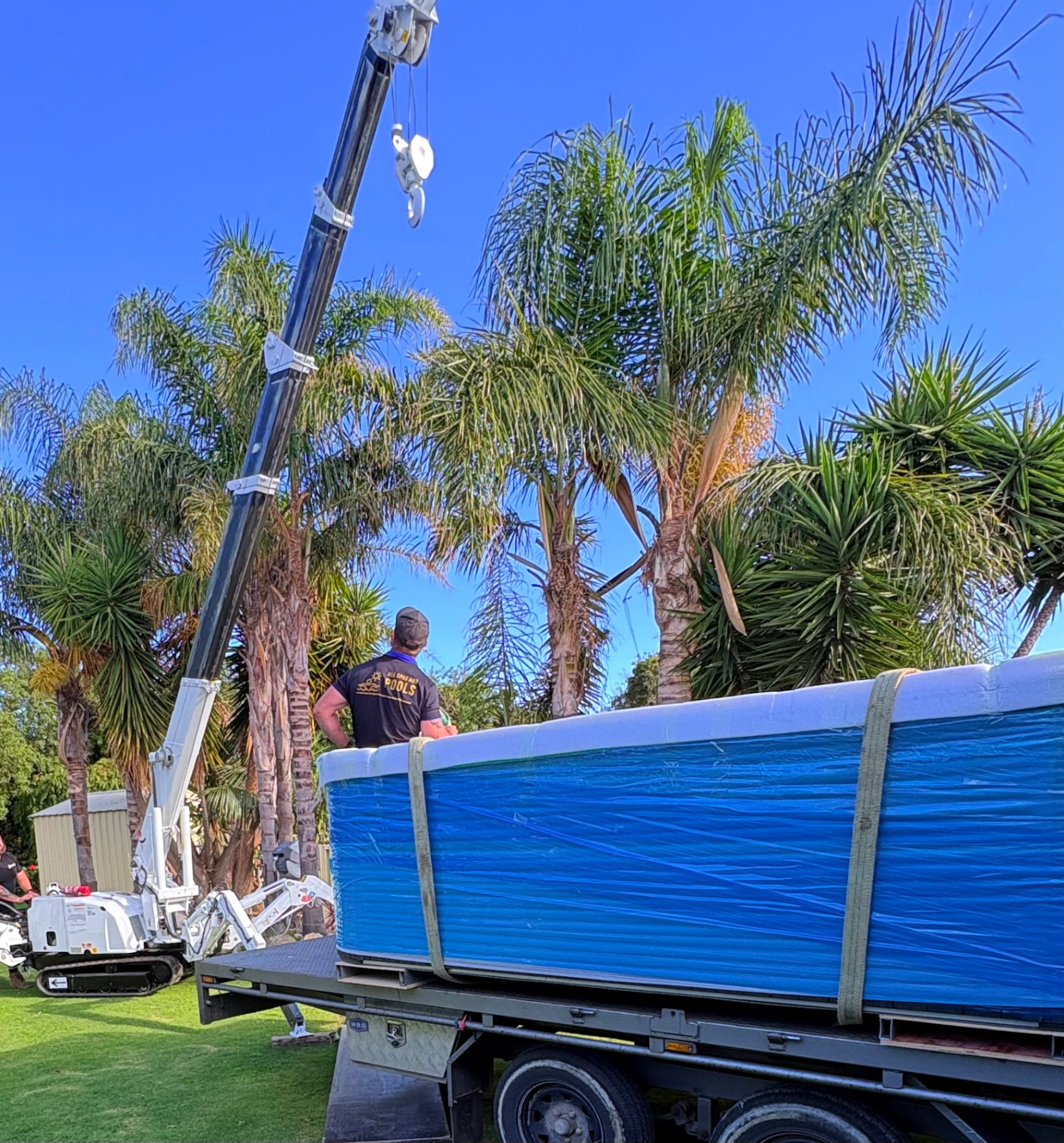 Mini crane delivering a swim spa
