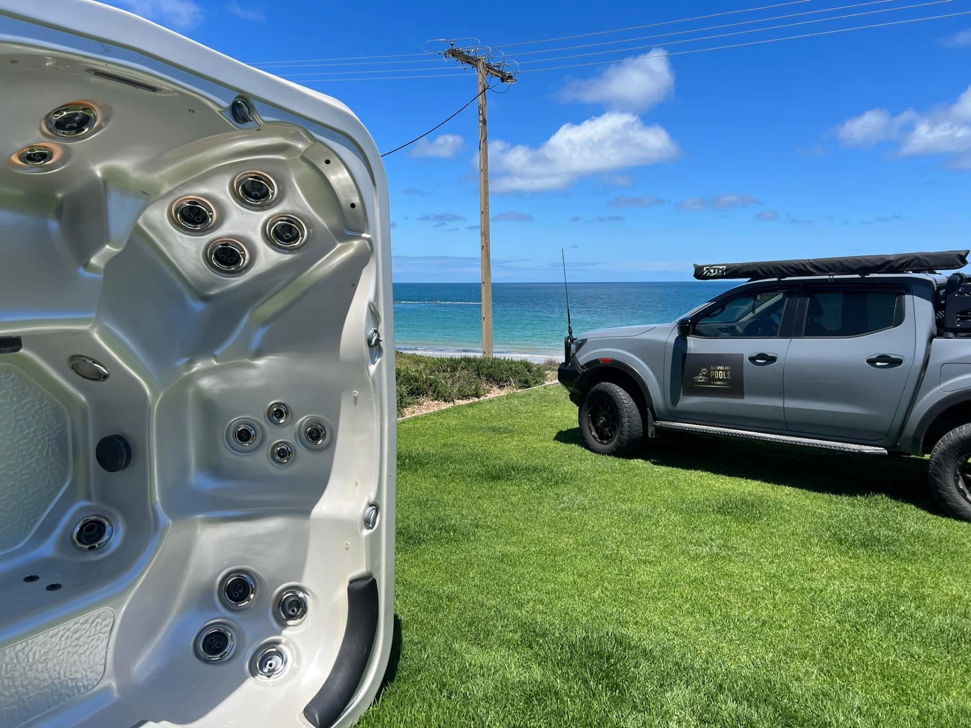 All Spas and Pools ute delivering a spa by the Adelaide coast